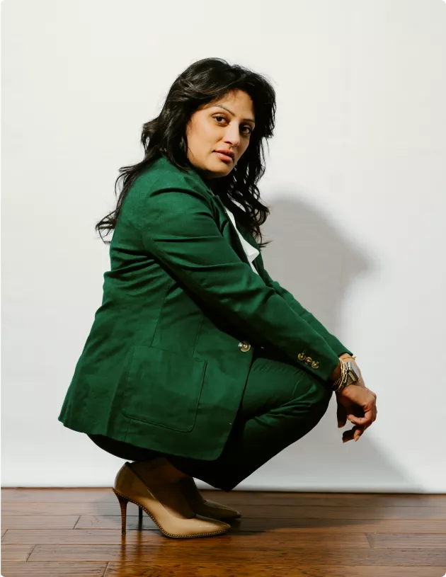 Dr. V in green blazer — editorial portrait