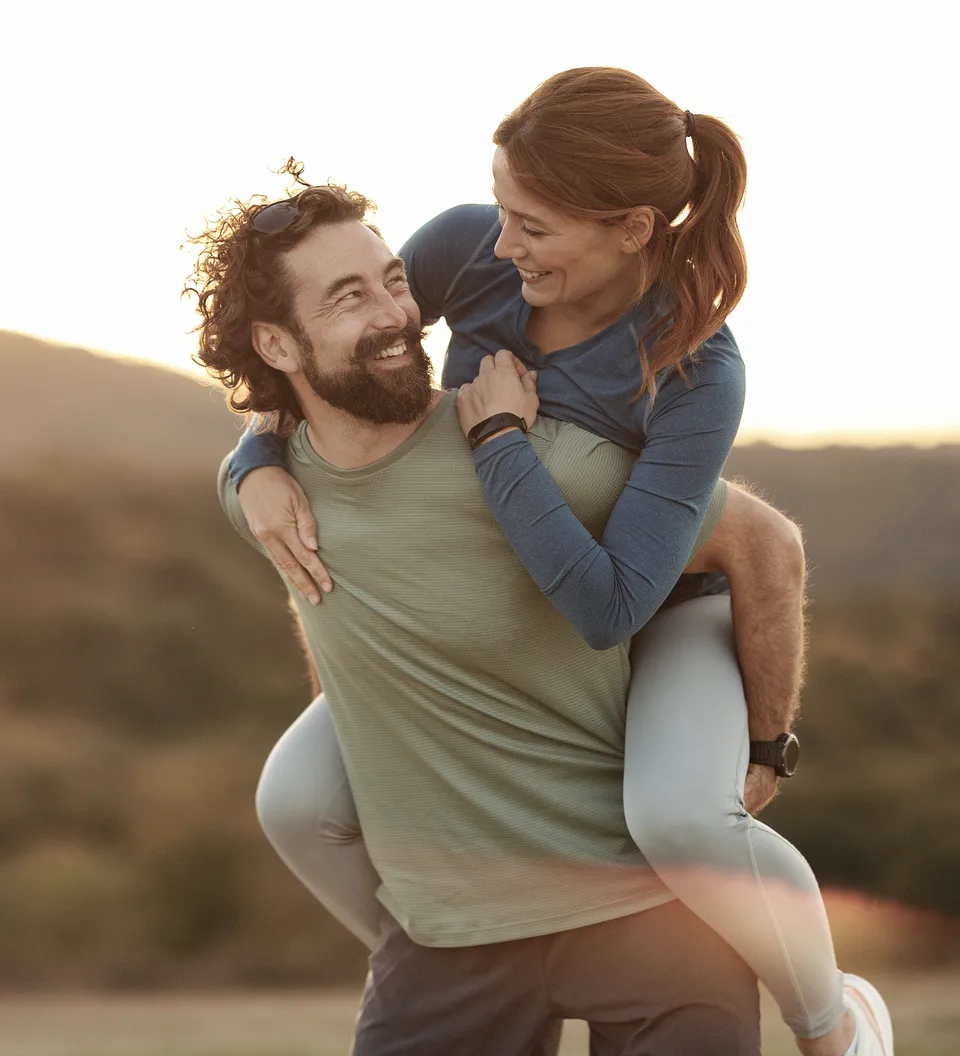 Abstract golden light particles floating through dark background evoking cellular energy